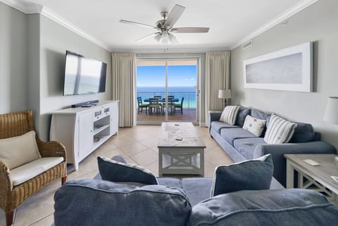 Unwind in your oceanfront living room where plush seating and stunning sea views create your perfect coastal retreat.