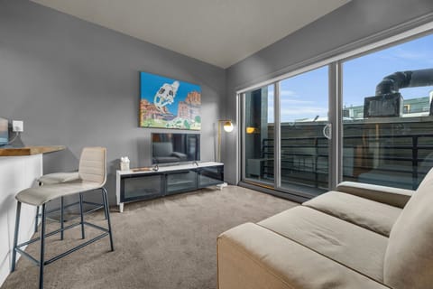 Living area: Smart TV with cable (40"), Building-controlled central heat and A/C (air speed can be adjusted by guests)