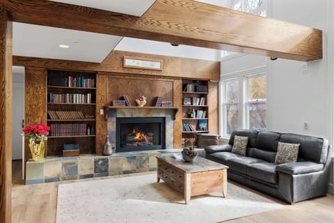 Cuddle up on the spacious, plush sectional under the stunning marquee lights as you kick back and settle in to recharge by the fireplace or stream your favorite movie or show on the large, flat-screen TV.