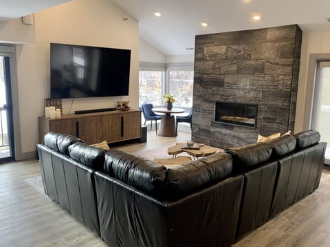 Huge brand new leather sectional to enjoy 85 inch TV