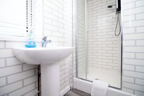 Separate tub and shower, deep soaking tub, hair dryer, towels