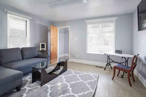 Living Room with table area to work on your office needs.