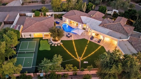 Private desert escape with lawn, resort pool, mountain views, and starry nights