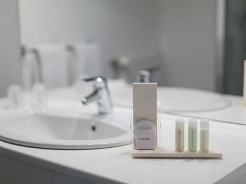 Shower, eco-friendly toiletries, hair dryer, towels