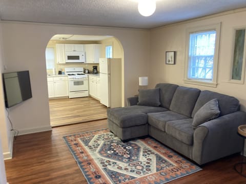 Living room has a 43" Roku TCL Smart TV that guests can log into privately.