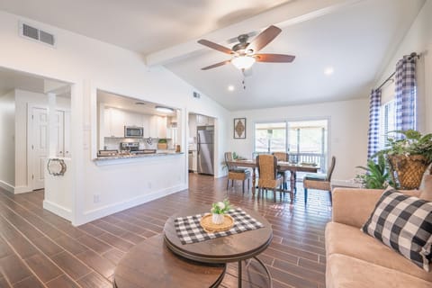 Open floor plan between living, dining, and kitchen