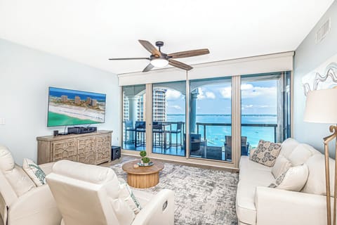 Relax in your bright living room with stunning ocean views, plush seating, and a peaceful coastal atmosphere.