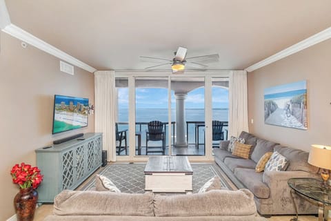 Unwind in your bright, coastal living space where glass doors frame endless ocean views. Step onto your private balcony and feel the sea breeze as you take in the horizon from your own peaceful retreat.