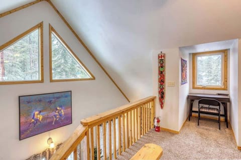 Open loft area with desk and chair