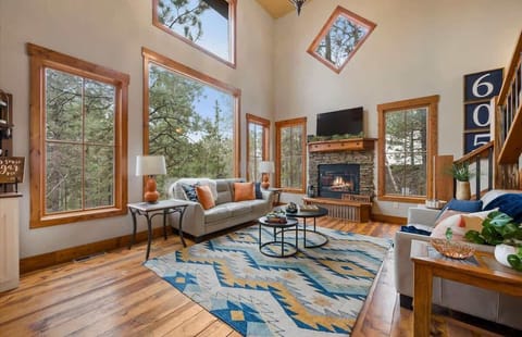 Main level living room with large open windows to enjoy the scenery