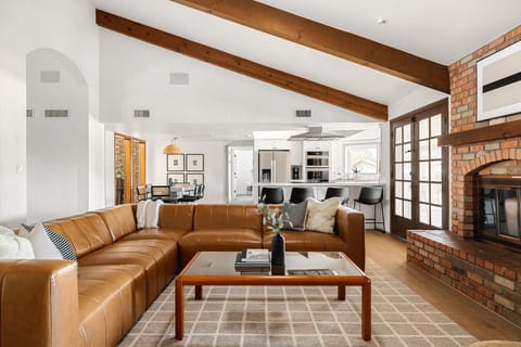 Relax in our spacious brown-and-white living room—perfect for hanging out and enjoying your favorite TV shows!