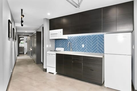 Full kitchen view looking back to front entry