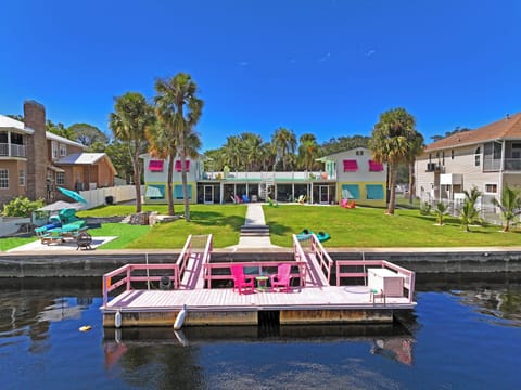 Back of the house with dock/boat parking