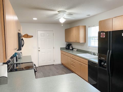 Kitchen - door to Golf Garage