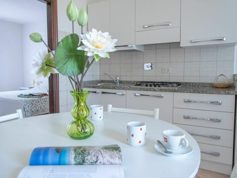 Flower, Plant, Table, Flowerpot, Cabinetry, Tableware, Vase, Dishware, Interior Design, Lighting