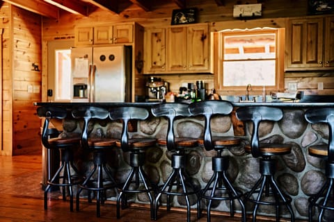 A breakfast area with 8 bar stools