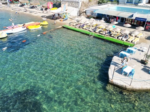 Private beach, free beach shuttle, sun loungers, beach umbrellas