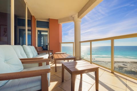 Unwind on your private oceanfront balcony with plush seating and endless sea views stretching to the horizon.