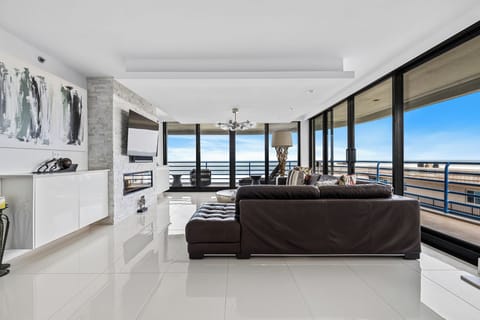 Spacious living room area with access to the balcony.