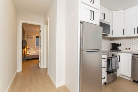 Modern kitchen includes cookware for longer term stays.