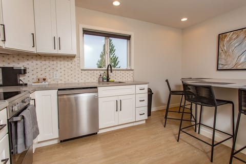 Large eating peninsula with comfortable seating for four.