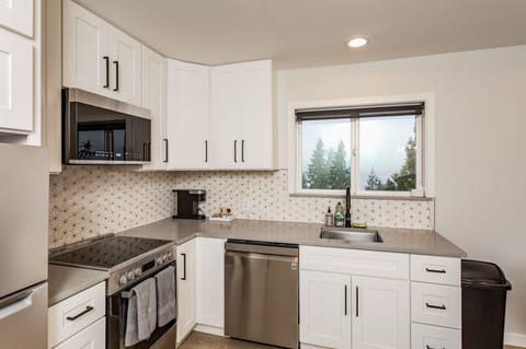 Full stainless steel appliance stack available for guest use.