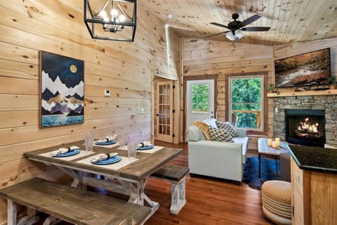 Modern living room and dining area with gas fireplace