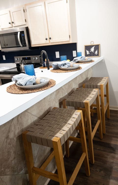 Kitchen with bar seating and dining table