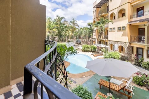 Balcony facing pool from main bedroom