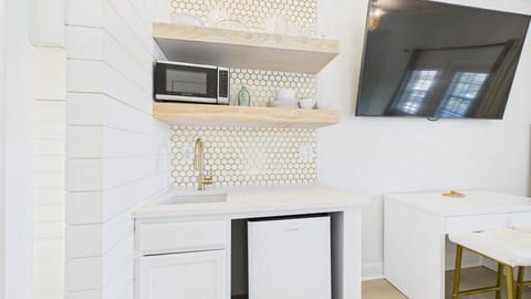 Kitchenette equipped with mini fridge and microwave