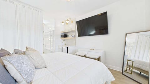 King bed and TV in living area (sleeps 2)