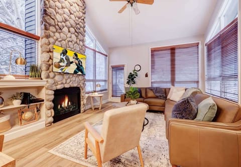 Living Room: Gather 'round the fire and enjoy modern comforts with stunning views of the snow!