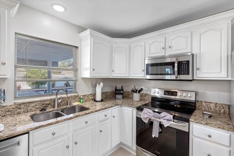 Contemporary, well-equipped, and spacious kitchen.