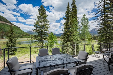 Deck off the Main Living Space with mountain and lake views