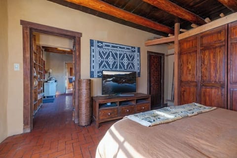Bedroom with queen bed and flat screen TV