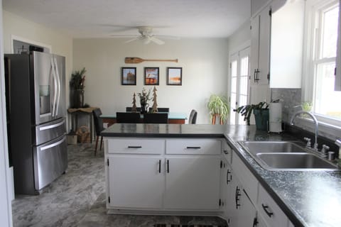 Kitchen is open to dining area, seats 6. 