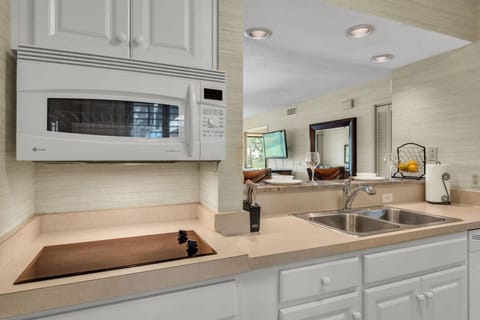 Kitchen is equipped with a 2 burner stove top & microwave that doubles as a convection oven!