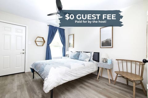 Rest easy in the master bedroom featuring a luxurious queen bed, ensuite bath with a walk-in shower, and soft, high-quality linens for a rejuvenating stay.