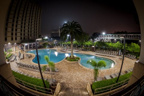 Outdoor pool, open 8:00 AM to midnight, pool umbrellas, sun loungers