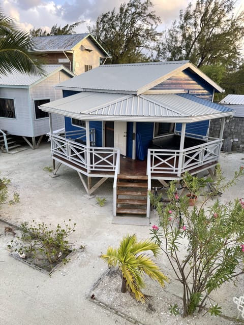 Exterior view of Moody Blue cottage showing rap around porch and courtesy bikes