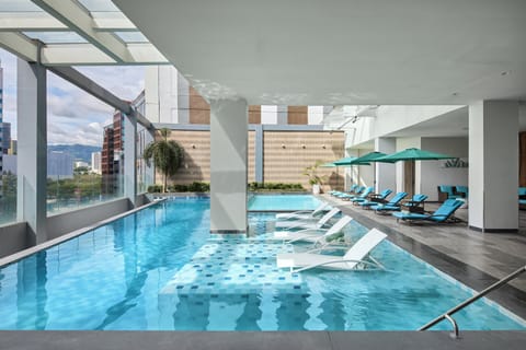 Outdoor pool, open 6:00 AM to 8:00 PM, pool umbrellas, sun loungers