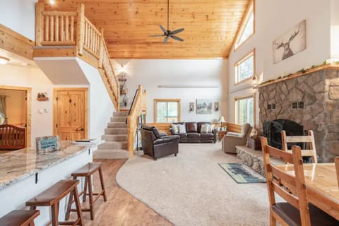 A large, open living area with a kitchen, dining, and living room await you.