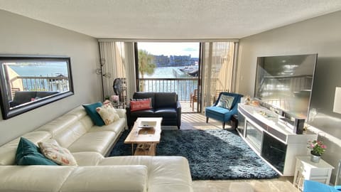 Open water views throughout the main living area and balcony.