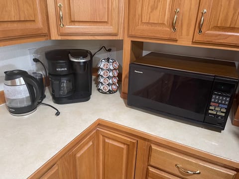 Keurig coffee maker, water kettle, coffee grinder and microwave