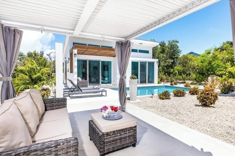  Pergola with louvred roof for sun or shade offers a relaxing space by the pool