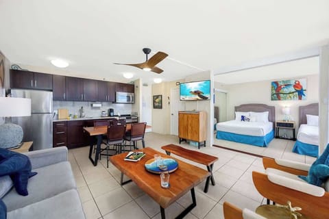 Settle right in! Your tropical escape awaits, complete with a full kitchen, comfy living space, and a bedroom with 2 queen beds!