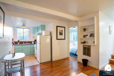 Simple and cozy dining space with plenty of light, great for meals or catching up over coffee.