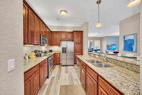 Gourmet Getaway: Our fully furnished kitchen is an open-concept retreat for food enthusiasts, combining functionality with a touch of sophisticated design