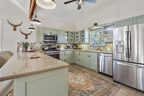 View showing microwave, range, oven, dishwasher and refrigerator.