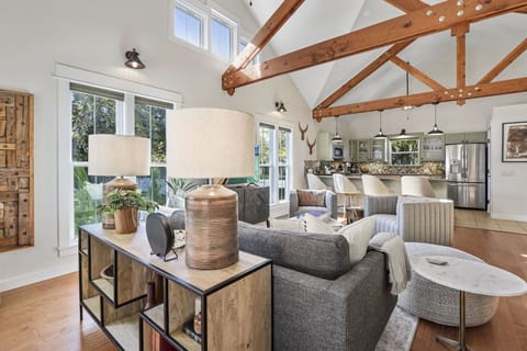 The kitchen with bar seating is just off the living room.